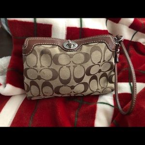 ‼️SOLD‼️

Coach wristlet‼️ Reduced‼️